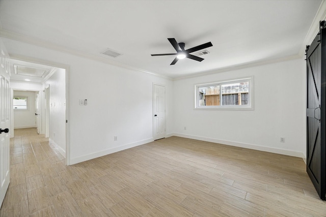 9711 Braewick Dr, Houston, TX 77096 - unfurnished bedroom with a barn door, crown molding, light wood-style floors, and a ceiling fan
