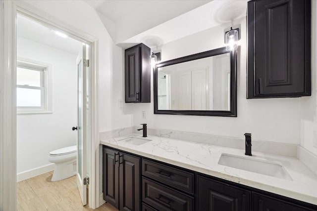 9711 Braewick Dr, Houston, TX 77096 - bathroom with double vanity and toilet