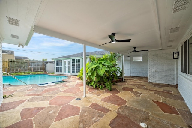 9711 Braewick Dr, Houston, TX 77096 - view of pool featuring french doors, a patio area, an outbuilding, and ceiling fan