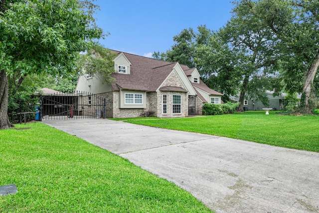 306 Hickory Ridge Dr, Shenandoah, TX 77381 - view of front facade with driveway, a gate, a shingled roof, and brick siding