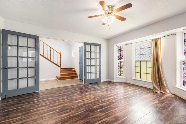 306 Hickory Ridge Dr, Shenandoah, TX 77381 - foyer entrance with wood finished floors, stairway, a ceiling fan, a textured ceiling, and french doors