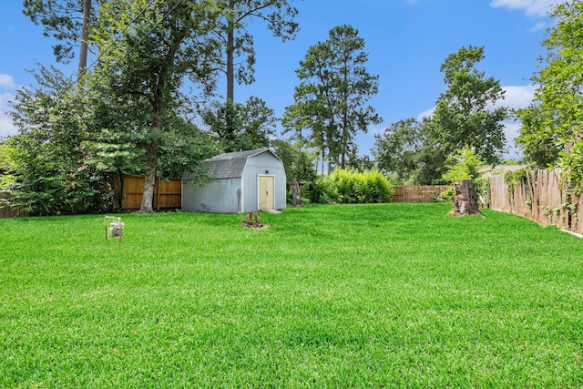 306 Hickory Ridge Dr, Shenandoah, TX 77381 - fenced backyard featuring a shed