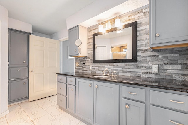 306 Hickory Ridge Dr, Shenandoah, TX 77381 - bathroom featuring vanity, decorative backsplash, and marble finish flooring