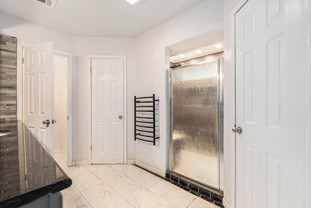 306 Hickory Ridge Dr, Shenandoah, TX 77381 - bathroom featuring marble look tiles and a shower stall