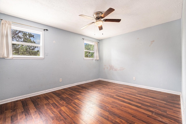 306 Hickory Ridge Dr, Shenandoah, TX 77381 - empty room featuring dark wood-style flooring, ceiling fan, and a textured ceiling