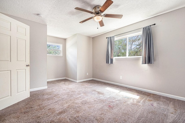 306 Hickory Ridge Dr, Shenandoah, TX 77381 - unfurnished bedroom featuring carpet floors, a textured ceiling, and a ceiling fan