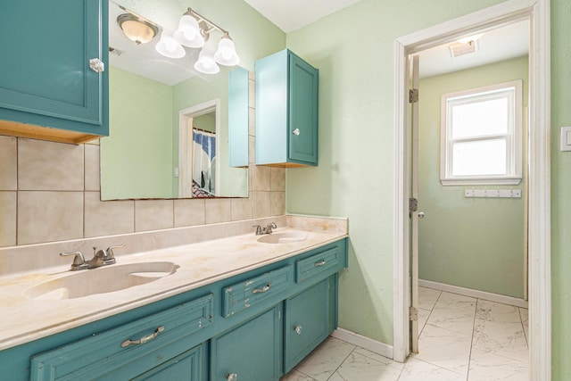 306 Hickory Ridge Dr, Shenandoah, TX 77381 - full bath with marble look tiles, double vanity, and backsplash