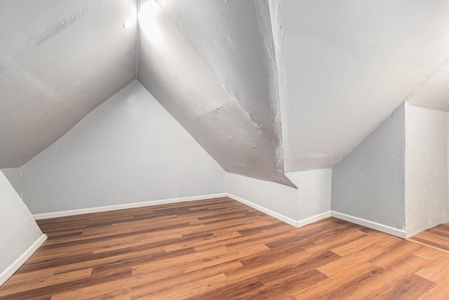 306 Hickory Ridge Dr, Shenandoah, TX 77381 - additional living space featuring wood finished floors and lofted ceiling