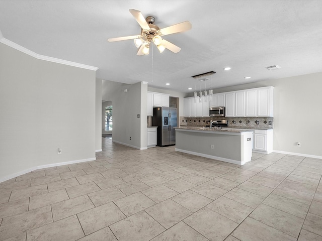 4315 Countrycrossing Dr, Spring, TX 77388 - kitchen featuring stainless steel appliances, ceiling fan, backsplash, arched walkways, and recessed lighting