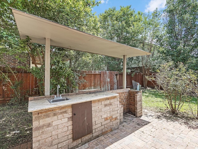 4315 Countrycrossing Dr, Spring, TX 77388 - view of patio / terrace featuring a sink and area for grilling