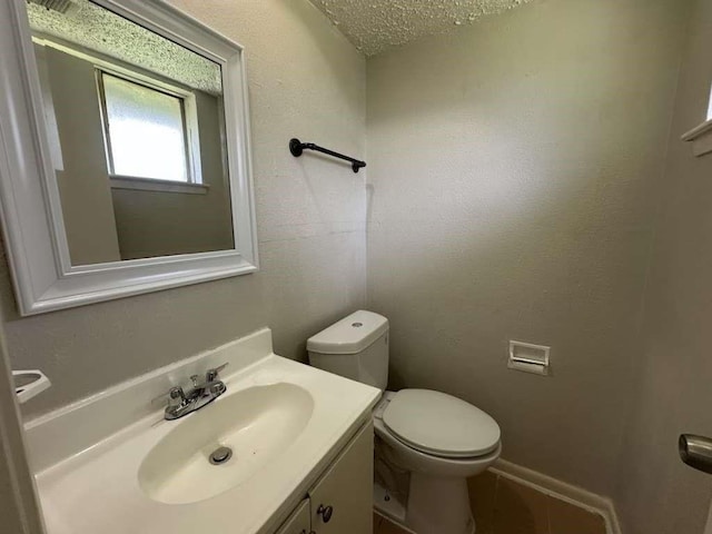 6523 Hanley Ln, Houston, TX 77016 - bathroom featuring vanity, a textured ceiling, and tile patterned floors