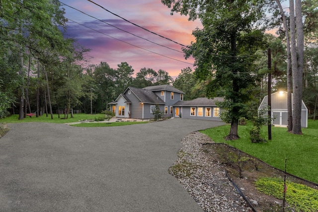 1518 Honea Egypt Rd, Magnolia, TX 77354 - view of front of home featuring driveway and a front lawn