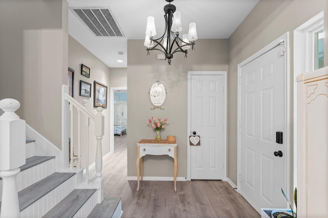 1518 Honea Egypt Rd, Magnolia, TX 77354 - foyer entrance with a chandelier, wood finished floors, and stairs
