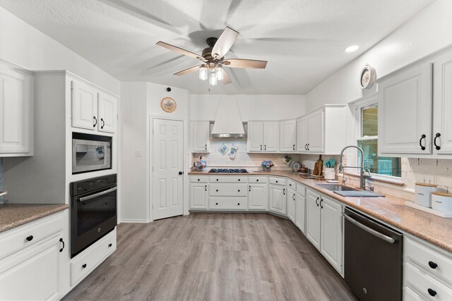 1518 Honea Egypt Rd, Magnolia, TX 77354 - kitchen featuring dishwasher, oven, stainless steel microwave, ceiling fan, and gas stovetop