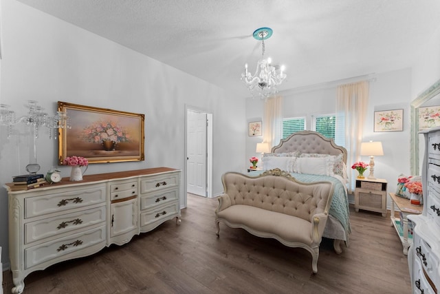 1518 Honea Egypt Rd, Magnolia, TX 77354 - bedroom with a chandelier and dark wood-type flooring