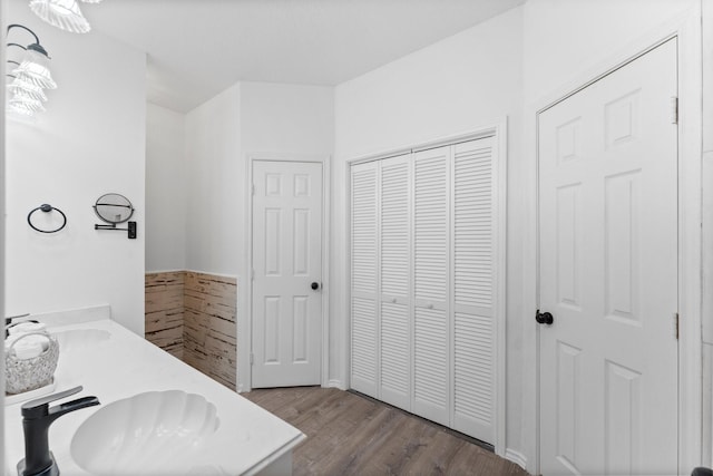 1518 Honea Egypt Rd, Magnolia, TX 77354 - bathroom featuring a closet, wood finished floors, and double vanity