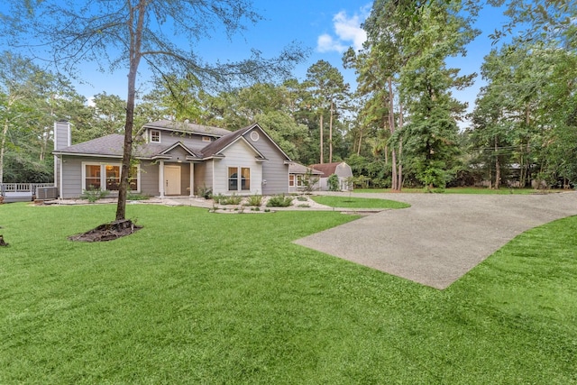 1518 Honea Egypt Rd, Magnolia, TX 77354 - view of front facade with a chimney and a front lawn