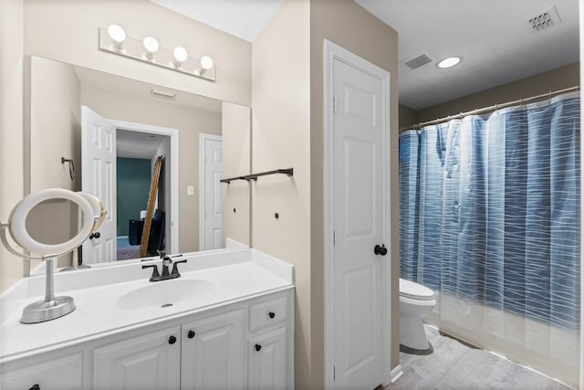 1518 Honea Egypt Rd, Magnolia, TX 77354 - bathroom with vanity, a shower with shower curtain, and wood finished floors