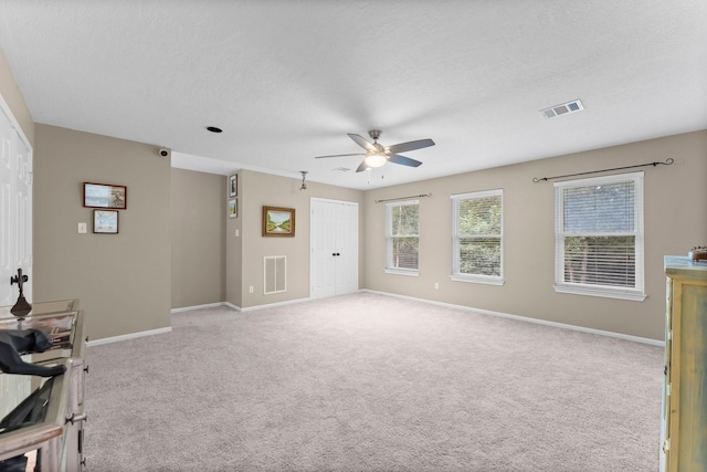 1518 Honea Egypt Rd, Magnolia, TX 77354 - unfurnished room featuring ceiling fan, light carpet, and a textured ceiling