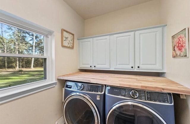 1518 Honea Egypt Rd, Magnolia, TX 77354 - laundry room with separate washer and dryer and cabinet space