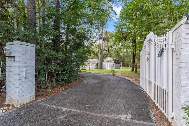 1518 Honea Egypt Rd, Magnolia, TX 77354 - view of asphalt driveway