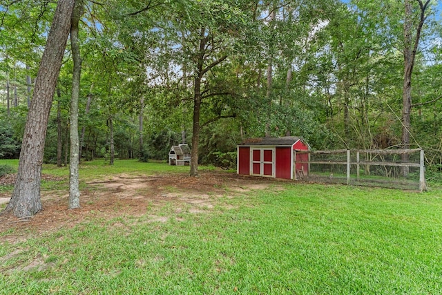 1518 Honea Egypt Rd, Magnolia, TX 77354 - view of green lawn with a shed and a forest view