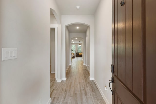 10005 Red Beadtree Pl, Conroe, TX 77385 - corridor with arched walkways and light wood-type flooring