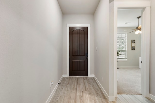 10005 Red Beadtree Pl, Conroe, TX 77385 - doorway featuring light wood-style floors and a ceiling fan