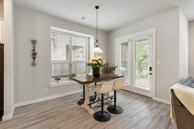 10005 Red Beadtree Pl, Conroe, TX 77385 - dining area with healthy amount of natural light and light wood-style flooring