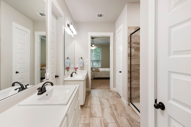 10005 Red Beadtree Pl, Conroe, TX 77385 - ensuite bathroom featuring a ceiling fan, a stall shower, and vanity