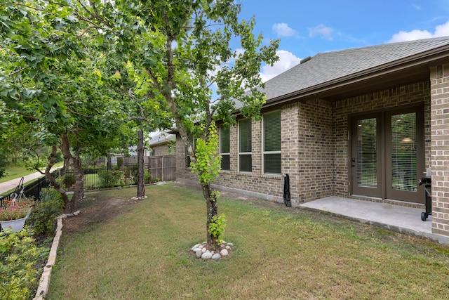 10005 Red Beadtree Pl, Conroe, TX 77385 - view of yard featuring french doors