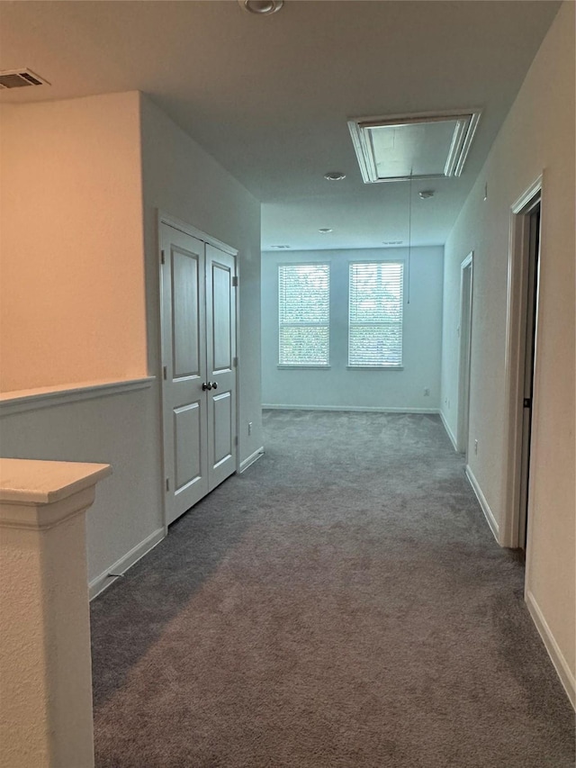 4727 Glen Isle Dr, Houston, TX 77009 - corridor featuring attic access and carpet flooring