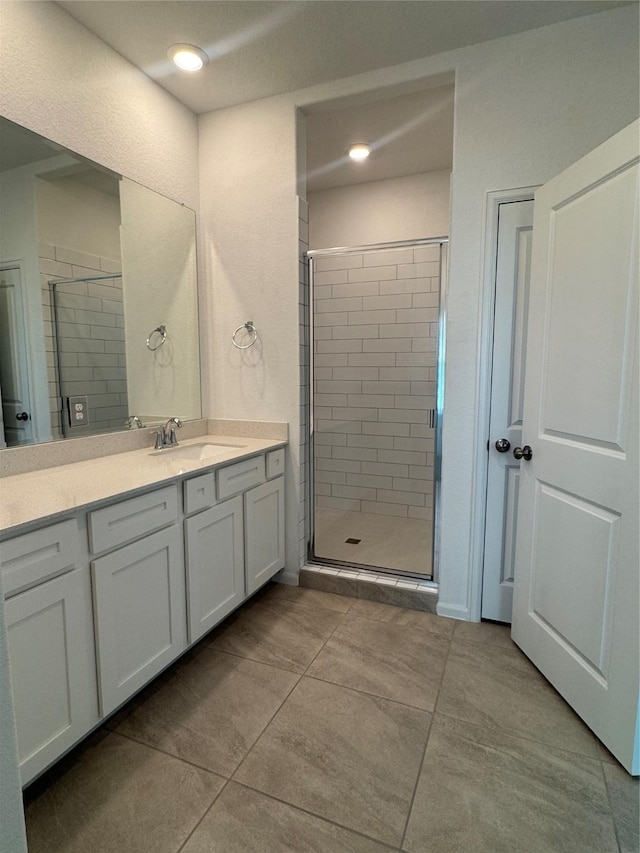 4727 Glen Isle Dr, Houston, TX 77009 - full bath with vanity, a shower stall, tile patterned floors, and recessed lighting