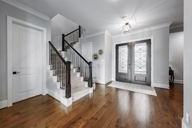 3239 Caney Dr, Katy, TX 77493 - foyer with ornamental molding, wood finished floors, stairway, and french doors