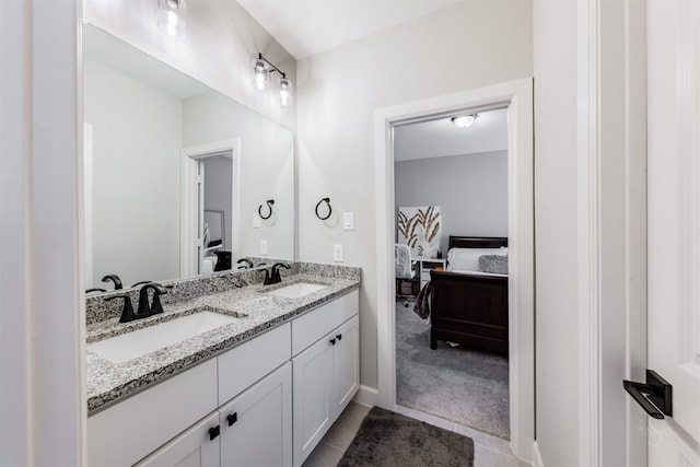 3239 Caney Dr, Katy, TX 77493 - ensuite bathroom with double vanity and tile patterned floors