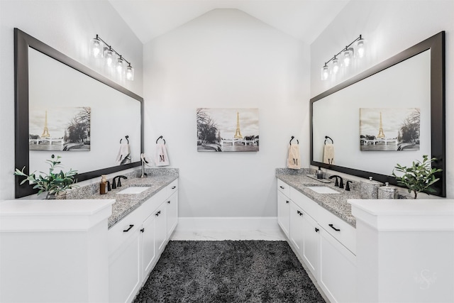 3239 Caney Dr, Katy, TX 77493 - full bath with marble finish floors, two vanities, and lofted ceiling