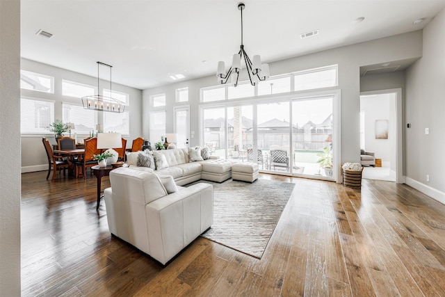 3239 Caney Dr, Katy, TX 77493 - living room with a chandelier, healthy amount of natural light, and wood finished floors
