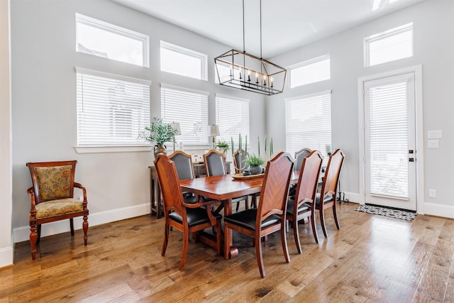 3239 Caney Dr, Katy, TX 77493 - dining area featuring a chandelier and light wood-style floors