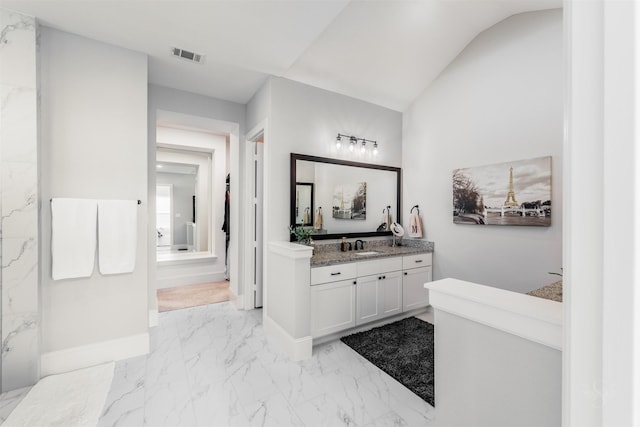 3239 Caney Dr, Katy, TX 77493 - bathroom with marble tiled flooring, vanity, and lofted ceiling