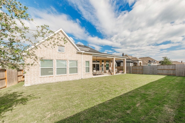 3239 Caney Dr, Katy, TX 77493 - rear view of property with brick siding, a patio area, and a fenced backyard