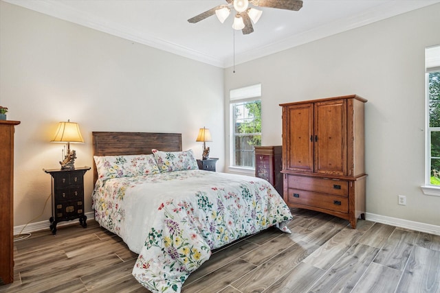 1607 N Primavera Dr, Pearland, TX 77581 - bedroom with light wood finished floors, crown molding, and ceiling fan