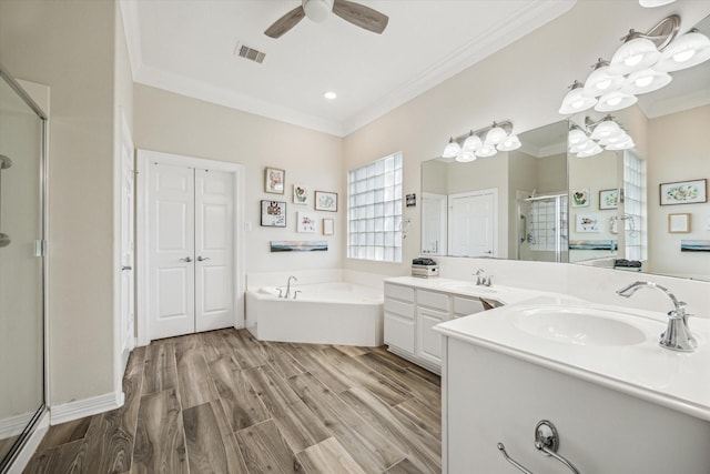1607 N Primavera Dr, Pearland, TX 77581 - bathroom featuring a shower stall, crown molding, a bath, vanity, and ceiling fan