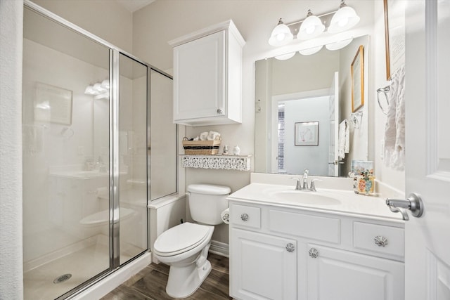 1607 N Primavera Dr, Pearland, TX 77581 - full bath featuring a stall shower, vanity, and wood finished floors