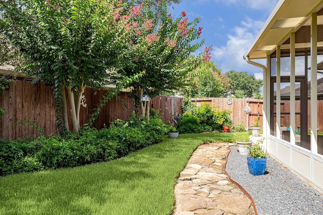 1607 N Primavera Dr, Pearland, TX 77581 - fenced backyard featuring a sunroom
