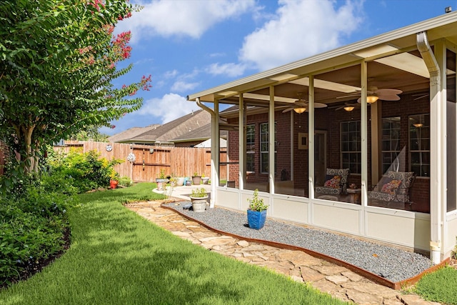 1607 N Primavera Dr, Pearland, TX 77581 - view of yard with a ceiling fan, a sunroom, and a gate