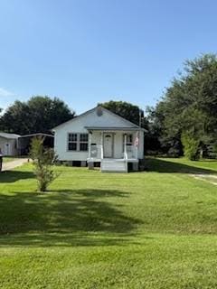 701 Lee Ave, Anahuac, TX 77514 - view of front of house featuring a front yard