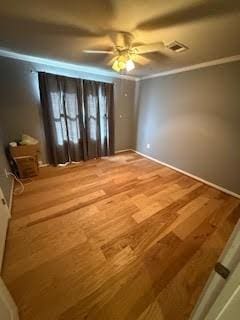 701 Lee Ave, Anahuac, TX 77514 - empty room featuring ceiling fan and wood finished floors