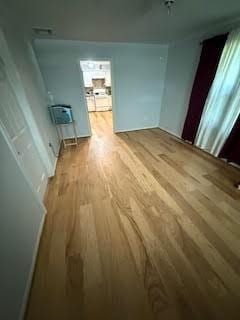 701 Lee Ave, Anahuac, TX 77514 - unfurnished dining area with wood finished floors