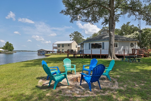 20559 Red Bud Ct, Thornton, TX 76687 - view of grassy yard with a deck with water view and an outdoor fire pit