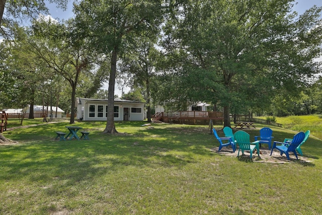 20559 Red Bud Ct, Thornton, TX 76687 - view of green lawn with a wooden deck